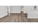 Spacious living area showcasing hardwood floors, fresh paint, and modern trim details at 313 W Church St, Angier, NC 27501