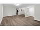 Open-concept living space with new flooring, neutral paint, and bright lighting at 313 W Church St, Angier, NC 27501