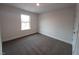 Bedroom with neutral walls, carpet flooring, and bright natural light at 315 New Twin Branch Ct, Smithfield, NC 27577