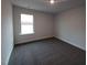 Carpeted bedroom with bright window and neutral walls at 315 New Twin Branch Ct, Smithfield, NC 27577