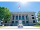 Exterior view of a stately courthouse with a flag, columns, and well-maintained landscaping at 315 New Twin Branch Ct, Smithfield, NC 27577