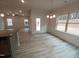 Bright dining room with decorative trim and large windows with gray wood flooring at 315 New Twin Branch Ct, Smithfield, NC 27577