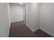 Narrow hallway with neutral paint and carpet flooring at 315 New Twin Branch Ct, Smithfield, NC 27577