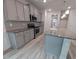 Kitchen with granite countertops, gray cabinets, stainless appliances, and pendant lighting at 315 New Twin Branch Ct, Smithfield, NC 27577