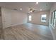 Bright and open living room with fan, recessed lights and large windows at 315 New Twin Branch Ct, Smithfield, NC 27577