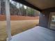 Covered patio overlooking grassy backyard and wooded area at 315 New Twin Branch Ct, Smithfield, NC 27577
