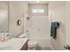 Cozy bathroom with shower and tub combination and small window at 320 Trout Valley Rd, Wake Forest, NC 27587