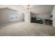 Large bonus room with bright window, soft carpet, neutral walls and a ceiling fan at 320 Trout Valley Rd, Wake Forest, NC 27587