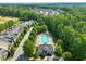 Aerial view of the community pool, surrounded by trees, homes, and greenery at 320 Trout Valley Rd, Wake Forest, NC 27587