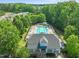 Aerial view of the community pool, clubhouse, lounge chairs and manicured trees at 320 Trout Valley Rd, Wake Forest, NC 27587