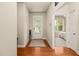 Inviting foyer with hardwood floors and neutral tones leads to a bright living space at 320 Trout Valley Rd, Wake Forest, NC 27587