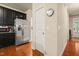 Kitchen with stainless steel refrigerator and appliances and hardwood floors at 320 Trout Valley Rd, Wake Forest, NC 27587