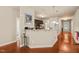 Kitchen view with bar top and hardwood floors at 320 Trout Valley Rd, Wake Forest, NC 27587