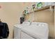 The laundry room has a white washer and dryer at 320 Trout Valley Rd, Wake Forest, NC 27587