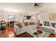 Expansive living room with hardwood floors, fireplace, and open-concept design, perfect for entertaining and Gathering gatherings at 320 Trout Valley Rd, Wake Forest, NC 27587