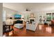 Cozy living room with fireplace, hardwood floors, and access to outdoor patio for seamless indoor-outdoor living at 320 Trout Valley Rd, Wake Forest, NC 27587