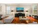 Large living room with hardwood floors and ample seating offers a comfortable and stylish space to unwind or host gatherings at 320 Trout Valley Rd, Wake Forest, NC 27587