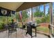 Enclosed patio with outside grill and dining area at 320 Trout Valley Rd, Wake Forest, NC 27587