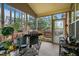 Inviting screened porch featuring an outdoor grill and access to the backyard with a hot tub at 320 Trout Valley Rd, Wake Forest, NC 27587