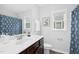 Bathroom with a white sink and dark brown cabinet at 34 Schoolhouse Way, Clayton, NC 27520