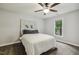 Charming bedroom with carpet, complemented by a unique headboard and a bright window at 3420 Greenville Loop Rd, Wake Forest, NC 27587