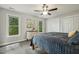 Cozy bedroom with natural light, plush carpet, and an ample closet for plenty of storage at 3420 Greenville Loop Rd, Wake Forest, NC 27587