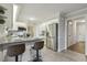 Kitchen with granite countertops, a stainless steel refrigerator, and counter seating at 3420 Greenville Loop Rd, Wake Forest, NC 27587