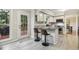 Eat-in kitchen with modern fixtures, stone countertops and an entrance to the outdoor deck at 3420 Greenville Loop Rd, Wake Forest, NC 27587