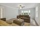Inviting living room with a bay window, ceiling fan and plank flooring, offers a comfortable space at 3420 Greenville Loop Rd, Wake Forest, NC 27587