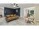 Open-concept living room with modern flooring and a view into the adjacent dining area at 3420 Greenville Loop Rd, Wake Forest, NC 27587