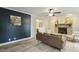 Comfortable living room with a brick fireplace, modern flooring, and stylish décor at 3420 Greenville Loop Rd, Wake Forest, NC 27587