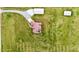 Expansive property featuring manicured lawn, a well and a charming residence from an aerial perspective at 3465 Covington Trl, Mebane, NC 27302