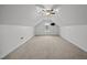 Finished attic room with neutral carpet, ceiling fan, and a dormer window at 3465 Covington Trl, Mebane, NC 27302