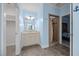 Bathroom view showing double vanity with a shower and an additional door at 3465 Covington Trl, Mebane, NC 27302