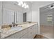 Bright bathroom with a double sink vanity featuring granite countertop and neutral cabinets at 3465 Covington Trl, Mebane, NC 27302