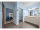 Bathroom view showing walk-in shower, double vanity and access to the main bedroom at 3465 Covington Trl, Mebane, NC 27302