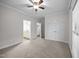 Spacious bedroom features neutral carpet, ceiling fan, and en-suite bath and walk-in closet at 3465 Covington Trl, Mebane, NC 27302