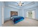 Spacious bedroom features tray ceilings, ceiling fan and a beautiful accent headboard at 3465 Covington Trl, Mebane, NC 27302