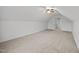Neutral bedroom with light carpet, white walls, angled ceilings, and a ceiling fan at 3465 Covington Trl, Mebane, NC 27302