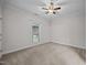 Simple bedroom with neutral walls, carpet, and trimwork, ceiling fan, and a window at 3465 Covington Trl, Mebane, NC 27302
