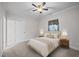 Bedroom with neutral walls features ceiling fan, large window and carpeted floors at 3465 Covington Trl, Mebane, NC 27302