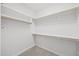 Spacious walk-in closet features shelving on all sides at 3465 Covington Trl, Mebane, NC 27302