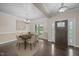 Elegant dining room featuring hardwood floors, sophisticated lighting, and a stylish table set for six at 3465 Covington Trl, Mebane, NC 27302