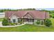 Beautiful one-story home with a manicured lawn and mature landscaping at 3465 Covington Trl, Mebane, NC 27302