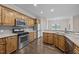 Well-equipped kitchen featuring stainless steel appliances and a granite countertop at 3465 Covington Trl, Mebane, NC 27302