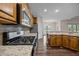 Well-equipped kitchen featuring stainless steel appliances and granite countertops at 3465 Covington Trl, Mebane, NC 27302