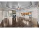 Spacious living area with hardwood floors and a stone fireplace open to the kitchen at 3465 Covington Trl, Mebane, NC 27302