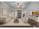 Open living area with hardwood floors, a stone fireplace, and neutral furniture at 3465 Covington Trl, Mebane, NC 27302