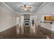 Open living space featuring hardwood floors, a stone fireplace, and an inviting atmosphere for relaxation at 3465 Covington Trl, Mebane, NC 27302