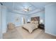 Charming main bedroom with a decorative tray ceiling, recessed lighting, and a serene color palette at 3465 Covington Trl, Mebane, NC 27302